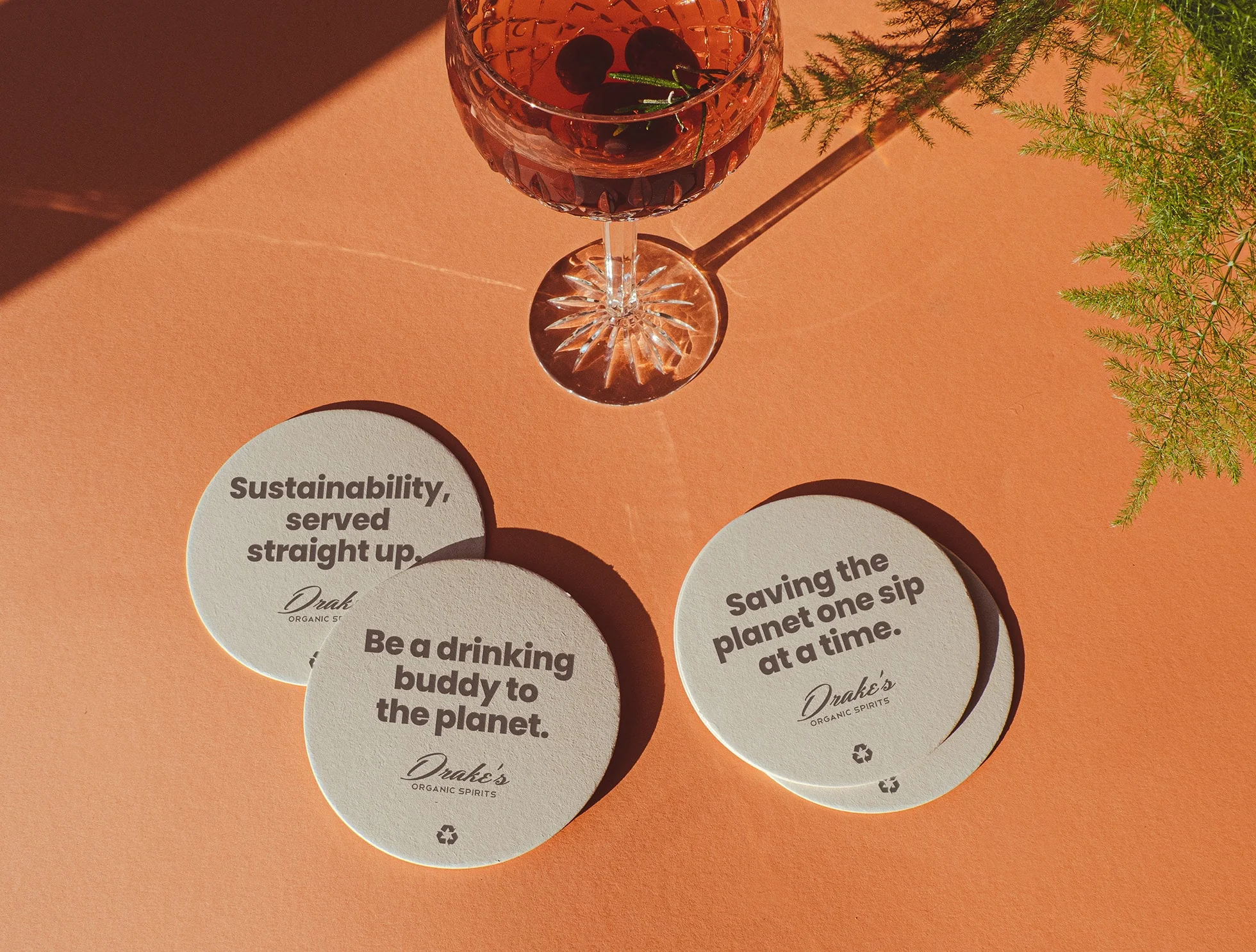 Celebrate Sustainably coaster mockup for Drake's Organic Spirits